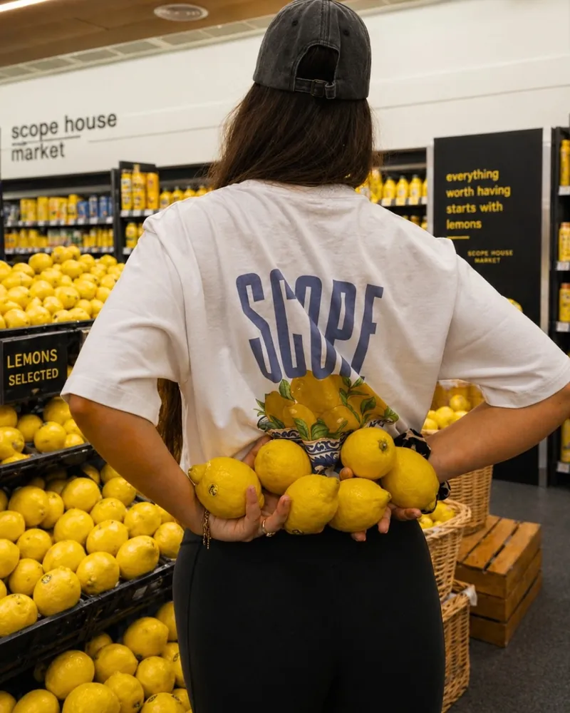 The Lemon tee from the back, lemons held behind