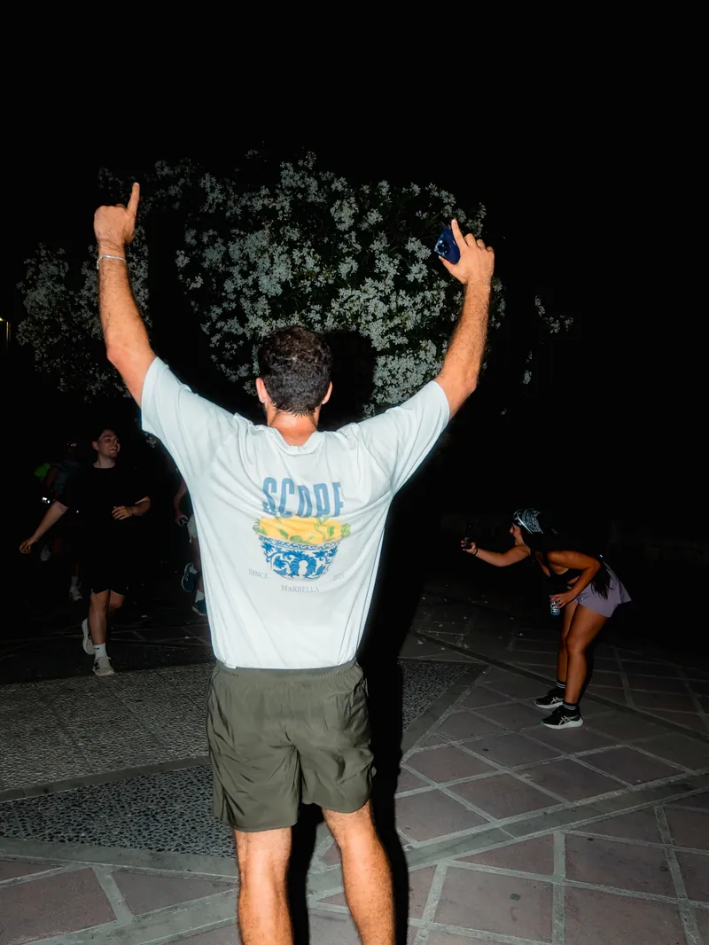 A runner in a Scope House tee at the night run in Puerto Banús