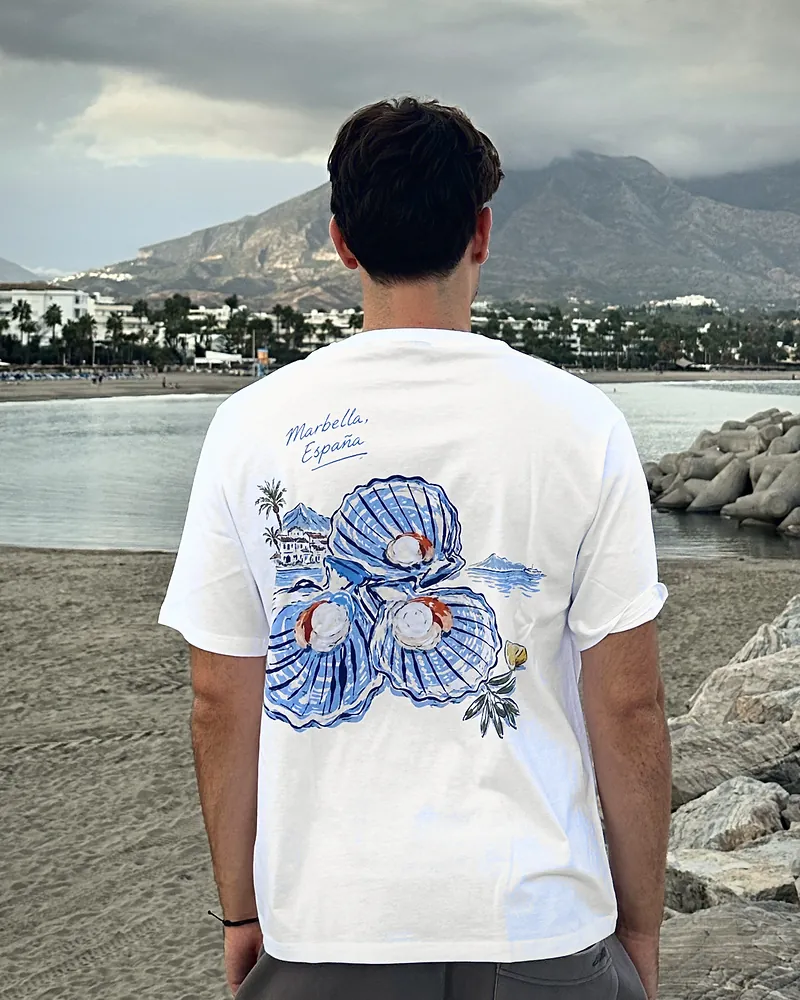 Clams in white, worn, seen from the back on the beach at Puerto Banús