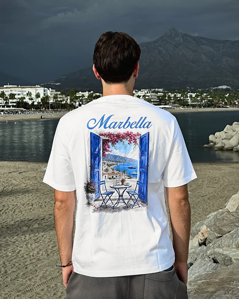 Marbella new window in white, worn, seen from the back on the beach at Puerto Banús